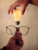 Image of a pair of glasses and a light bulb. 